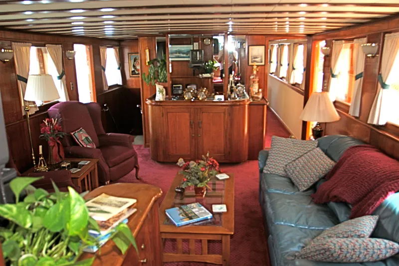 Slide: The Image of Interior of a classic yacht with wooden furniture and cozy decor. - 30