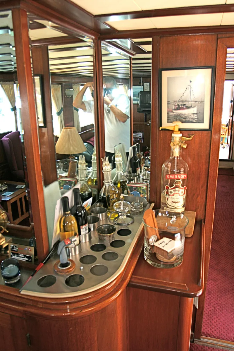 Slide: The Image of Interior of a classic yacht with bar and mirror, built in 1946. - 32