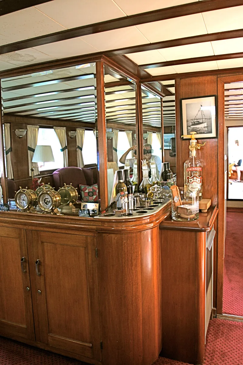 Slide: The Image of Interior of classic yacht with wooden furnishings and nautical decor. - 33