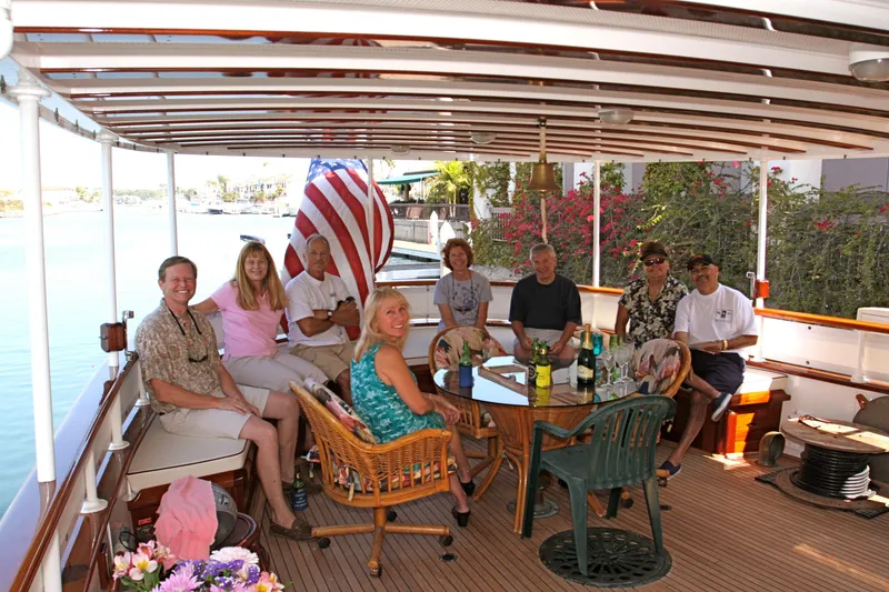 Slide: The Image of Group of people relaxing on a 1946 classic yacht, enjoying the day. - 37
