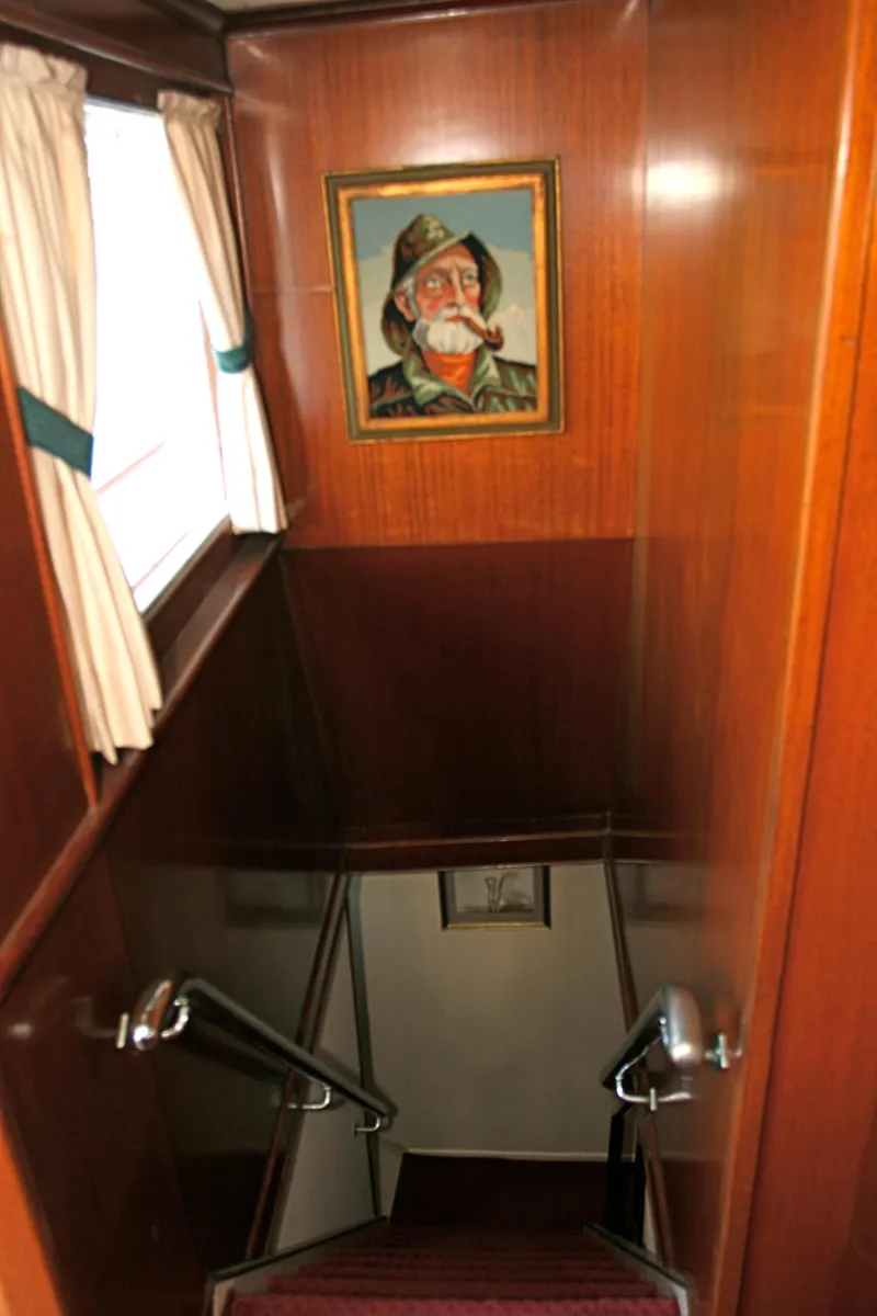 Slide: The Image of Wooden staircase in classic yacht with painting on the wall. - 38