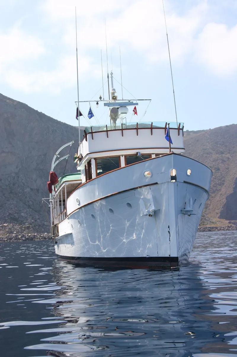 Slide: The Image of Classic 1946 J.M. Martinac yacht on calm waters. - 4