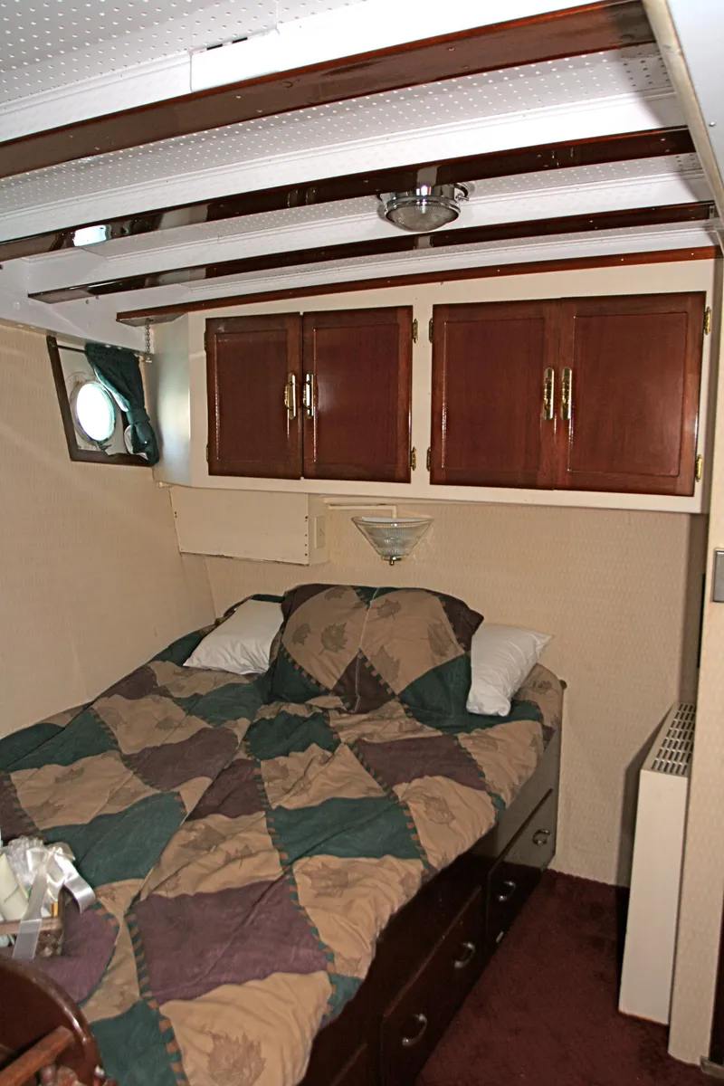Slide: The Image of Bedroom on a 1946 classic yacht with wooden cabinets. - 41