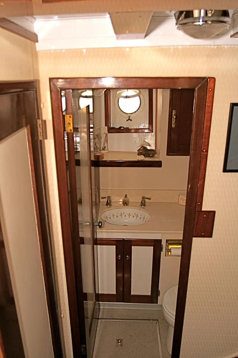 Slide: The Image of Interior of classic yacht with wood paneling and porthole. - 42