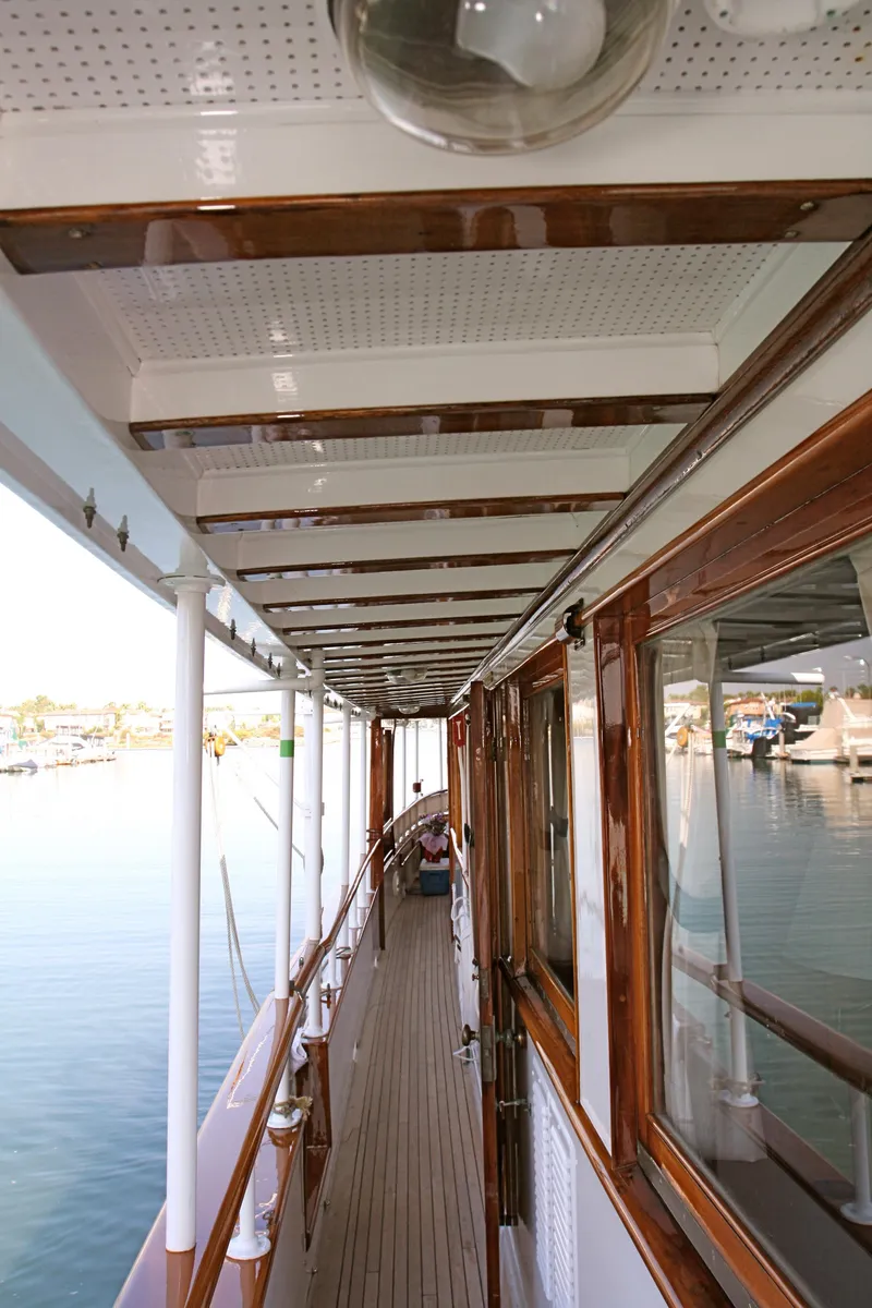Slide: The Image of Walkway on a classic yacht with wooden accents, built in 1946. - 47