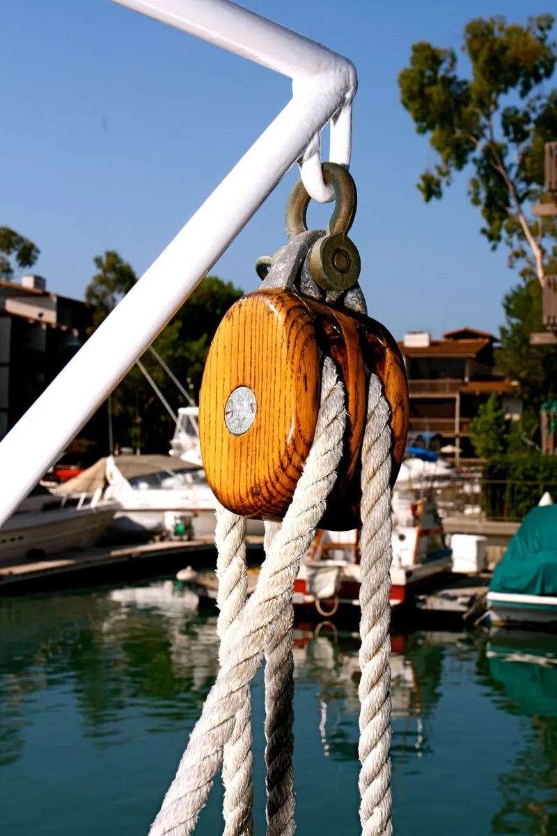 Slide: The Image of Wooden pulley on a classic yacht in the harbor. - 48