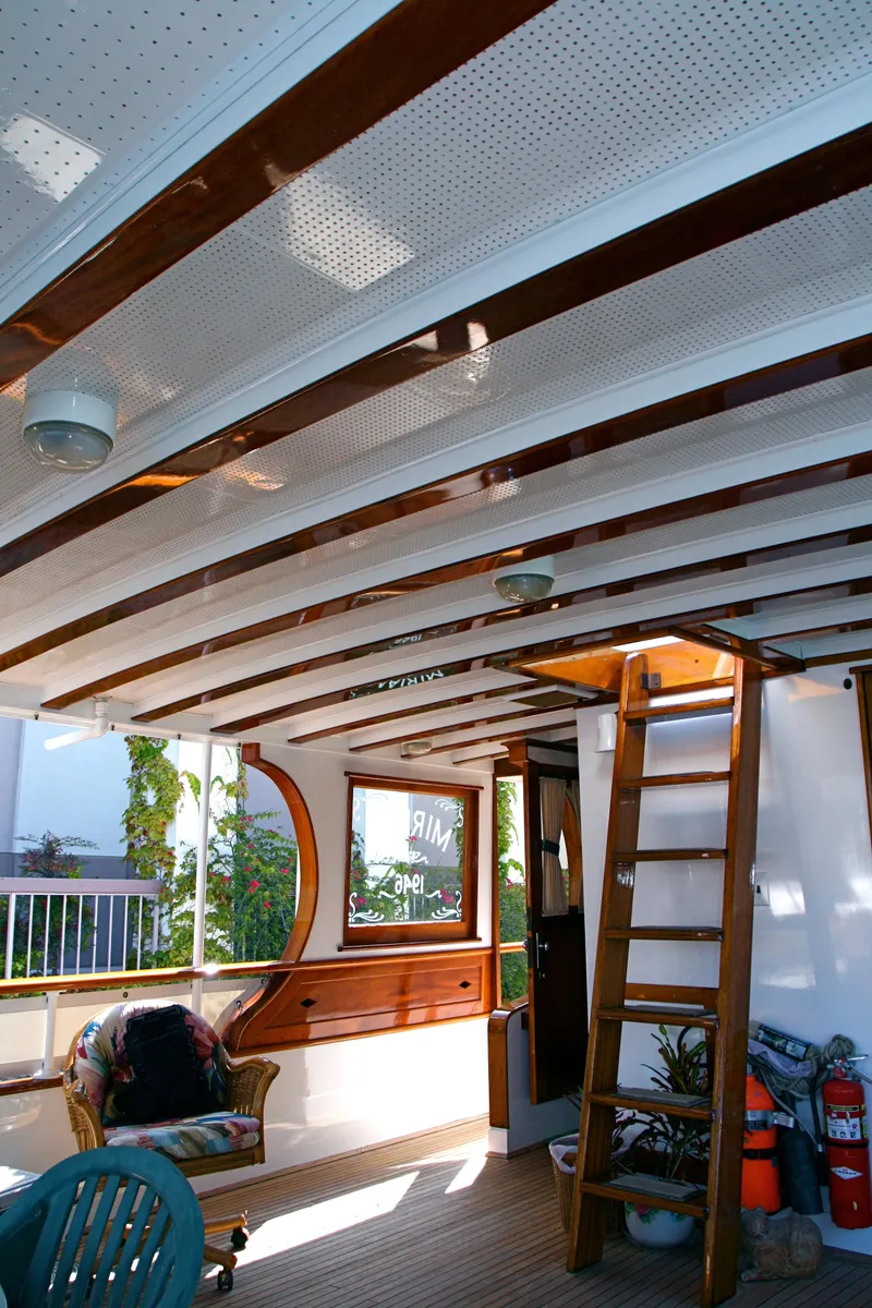 Slide: The Image of Interior of a classic yacht with wooden accents, built in 1946. - 49