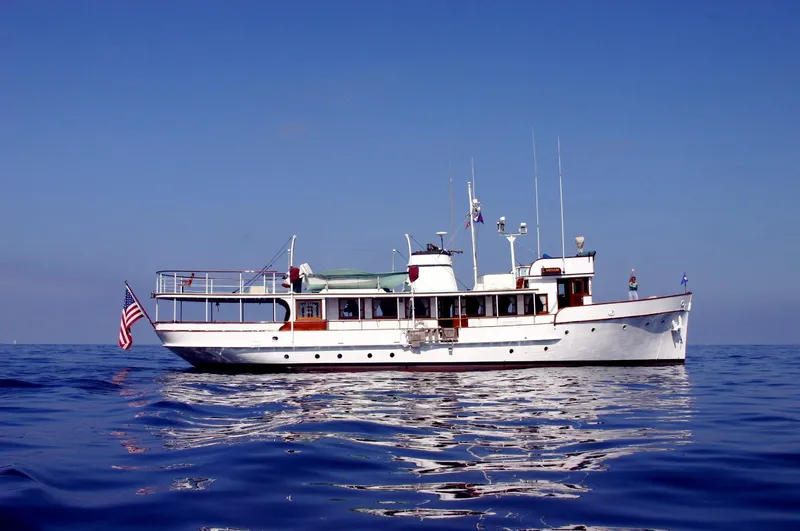 Slide: The Image of Classic 1946 J.M. Martinac motor yacht on calm sea. - 6