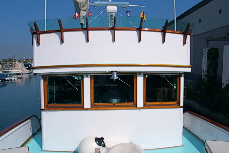 Slide: The Image of 1946 J.M. Martinac Fantail Motor Yacht, front view, harbor background. - 9