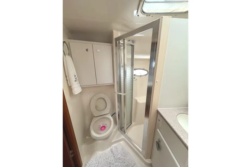 Slide: The Image of Bathroom interior of 1998 Tiara Yachts 4100 Open with shower and toilet. - 14