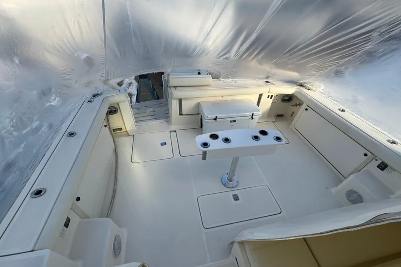 Slide: The Image of 1998 Tiara Yachts 4100 Open cockpit with seating and fishing rod holders. - 23