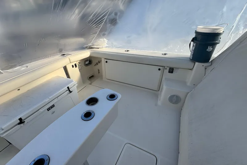 Slide: The Image of 1998 Tiara Yachts 4100 Open cockpit with seating and storage. - 24