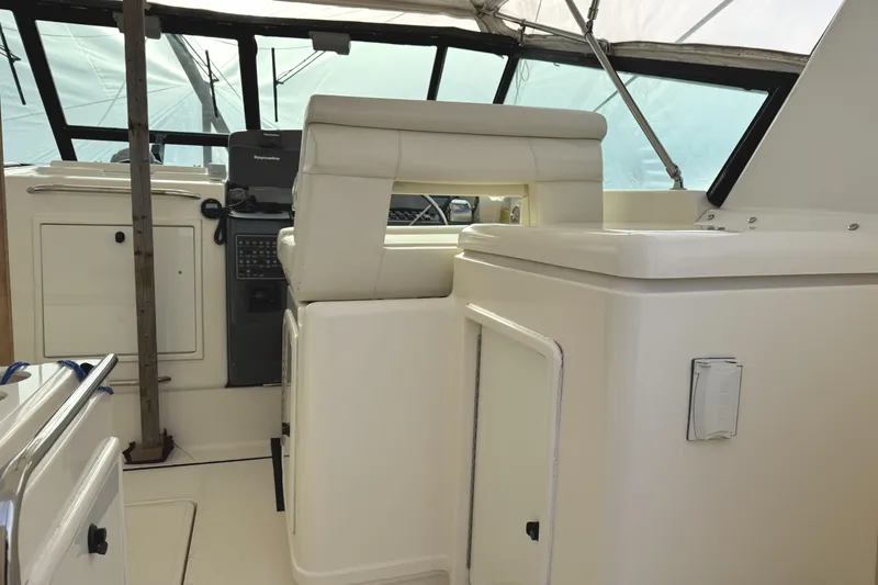 Slide: The Image of 1998 Tiara Yachts 4100 Open interior with helm and seating area. - 28