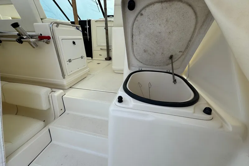 Slide: The Image of 1998 Tiara Yachts 4100 Open interior with seating and storage compartments. - 31