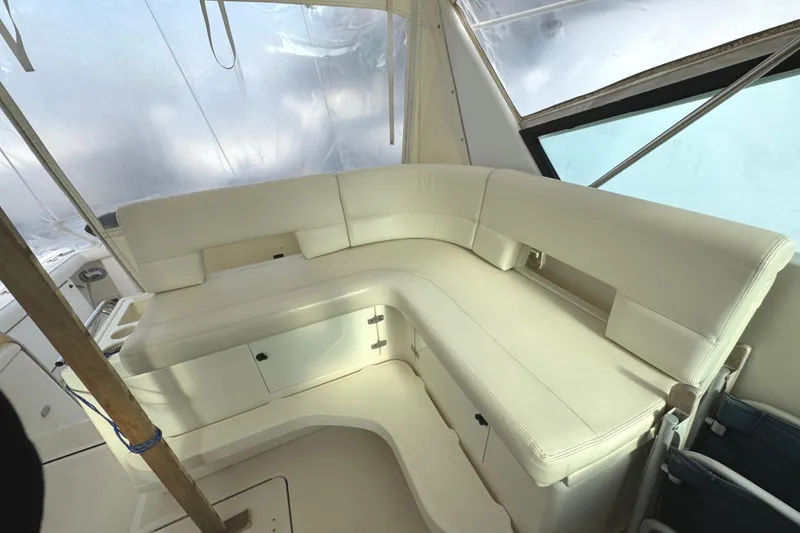 Slide: The Image of Luxurious white seating area on a 1998 Tiara Yachts 4100 Open boat. - 34