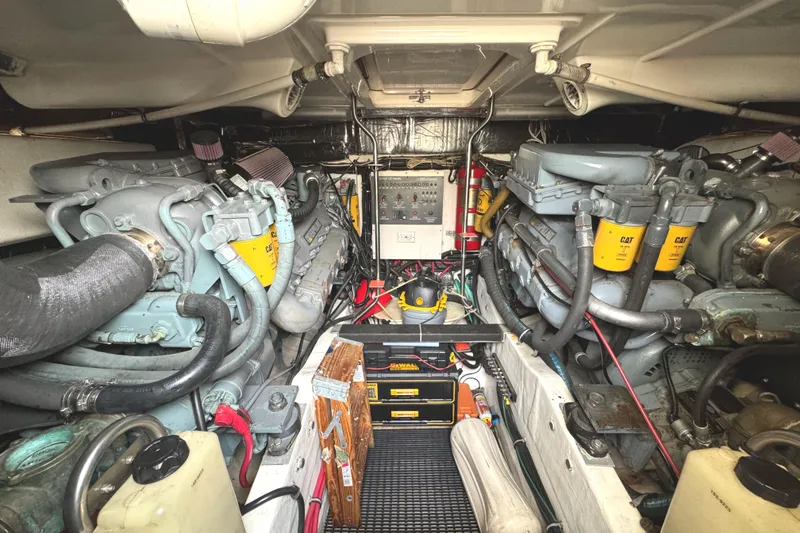 Slide: The Image of Engine room of a 1998 Tiara Yachts 4100 Open, featuring dual Caterpillar engines. - 35