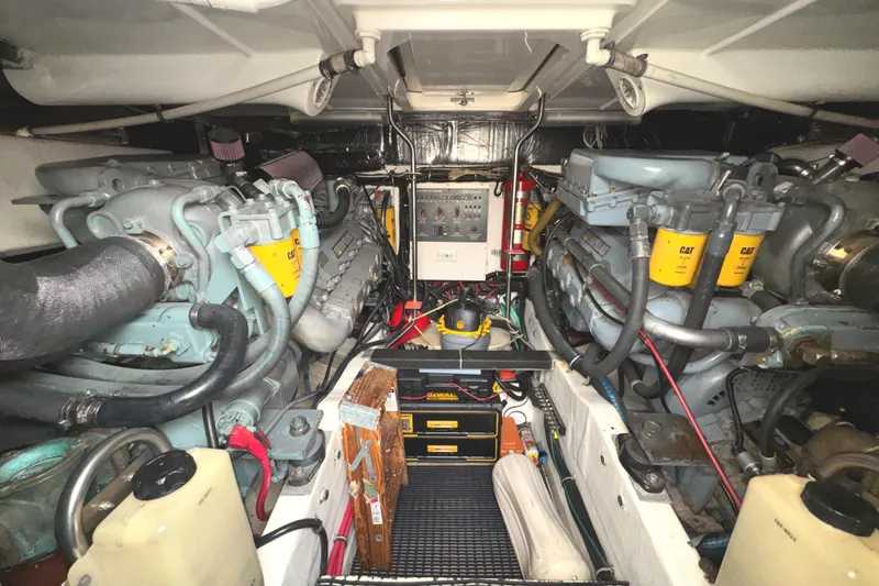 Slide: The Image of Engine room of a 1998 Tiara Yachts 4100 Open, featuring dual Caterpillar engines. - 36