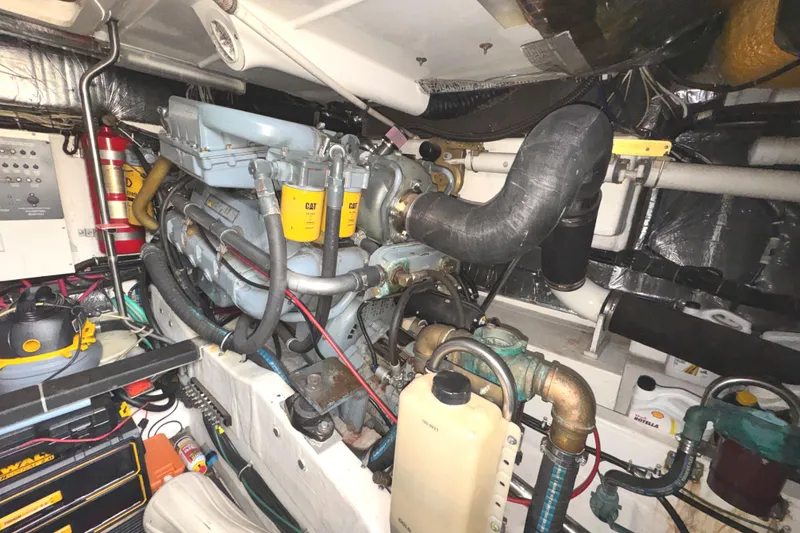 Slide: The Image of Engine room of a 1998 Tiara Yachts 4100 Open, featuring detailed mechanical components. - 37