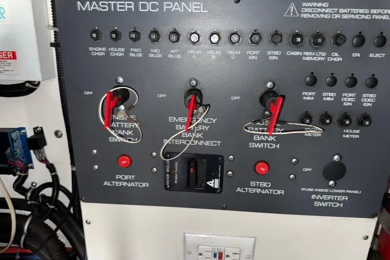 Slide: The Image of Master DC panel of a 1998 Tiara Yachts 4100 Open, featuring switches and indicators. - 41