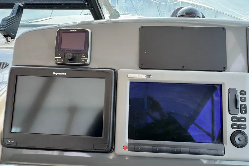 Slide: The Image of Control panel of a 1998 Tiara Yachts 4100 Open with Raymarine displays. - 5