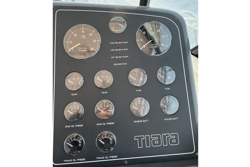 Slide: The Image of Instrument panel of a 1998 Tiara Yachts 4100 Open, featuring various gauges and indicators. - 6