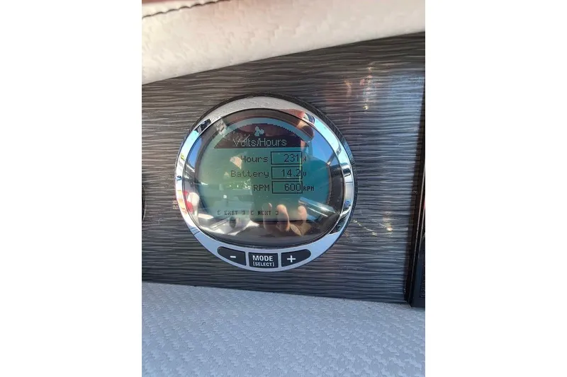 Slide: The Image of 2020 Four Winns HD270 RS boat on trailer, parked outdoors under clear blue sky. - 10