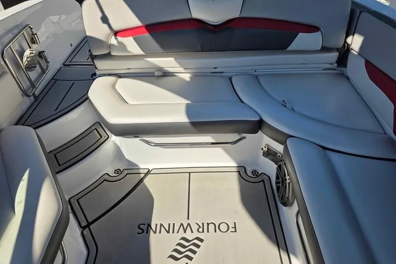 Slide: The Image of 2020 Four Winns HD270 RS boat with Mercury Verado engine on trailer. - 15