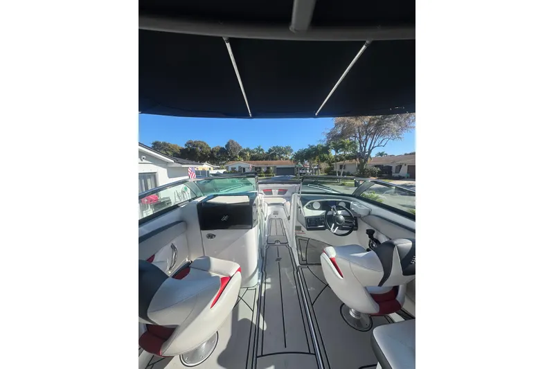 Slide: The Image of 2020 Four Winns HD270 RS boat interior with modern seating and steering wheel. - 25
