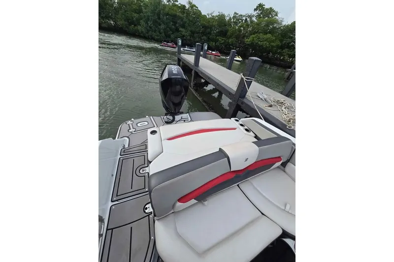 Slide: The Image of 2020 Four Winns HD270 RS boat with sleek design, black and red accents. - 3