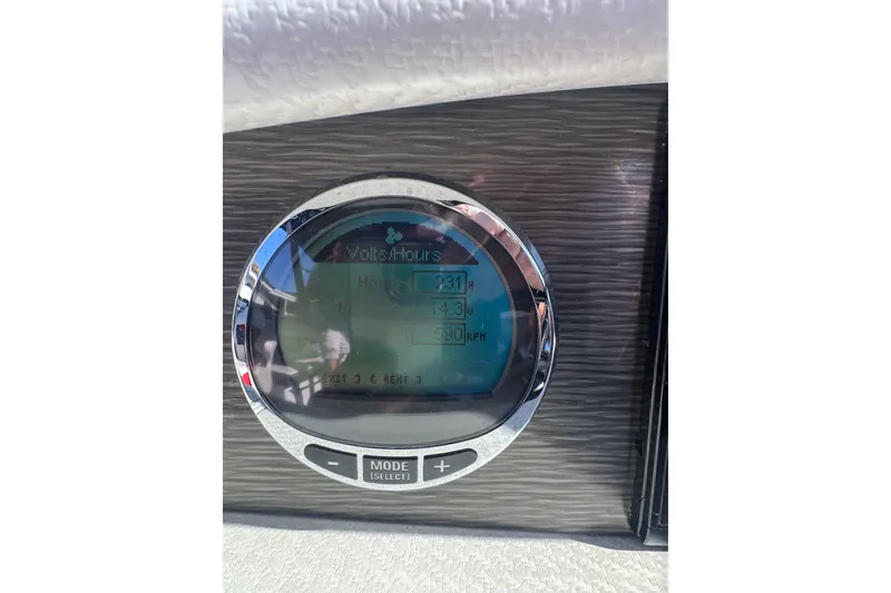 Slide: The Image of Dashboard display of 2020 Four Winns HD270 RS boat showing volts and hours. - 33