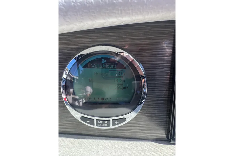 Slide: The Image of Dashboard display of a 2020 Four Winns HD270 RS boat showing volts and hours. - 34