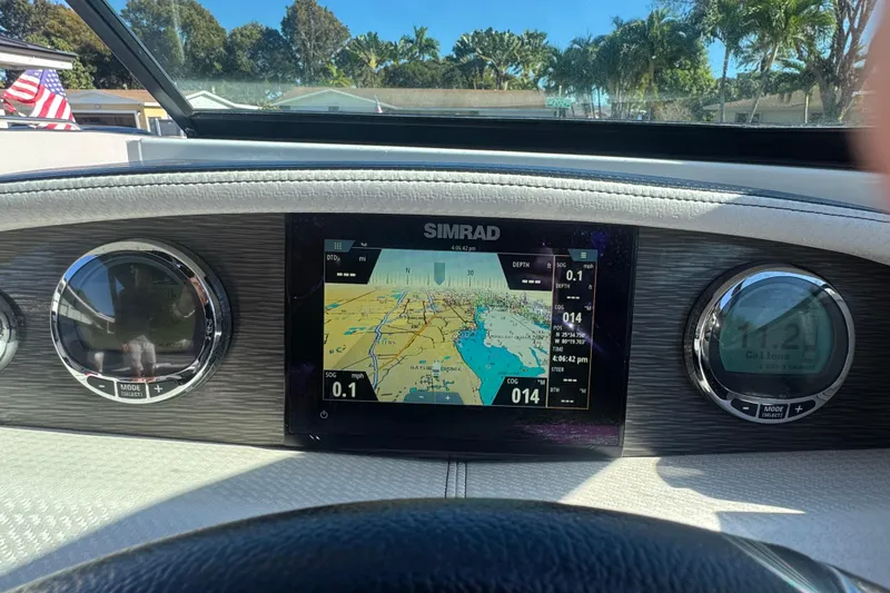 Slide: The Image of Dashboard of 2020 Four Winns HD270 RS with Simrad navigation display. - 38