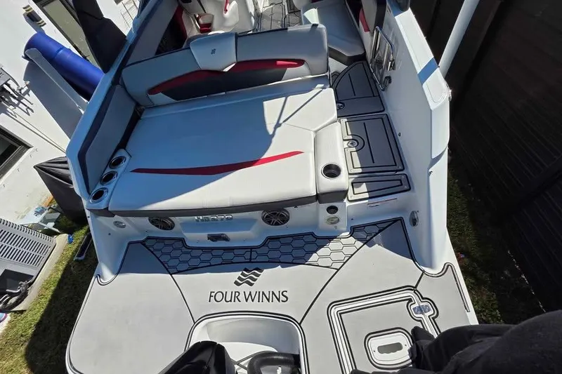 Slide: The Image of 2020 Four Winns HD270 RS boat on trailer, featuring sleek design and vibrant colors. - 4