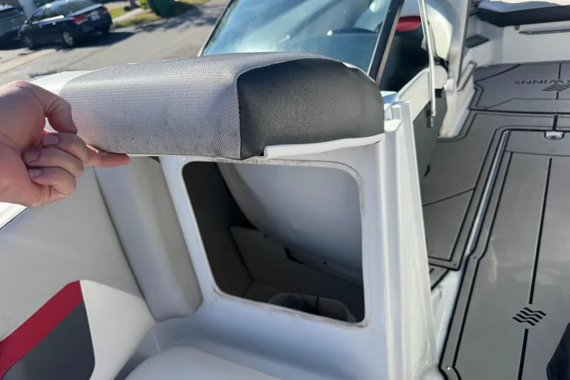 Slide: The Image of 2020 Four Winns HD270 RS boat interior with open storage compartment. - 44