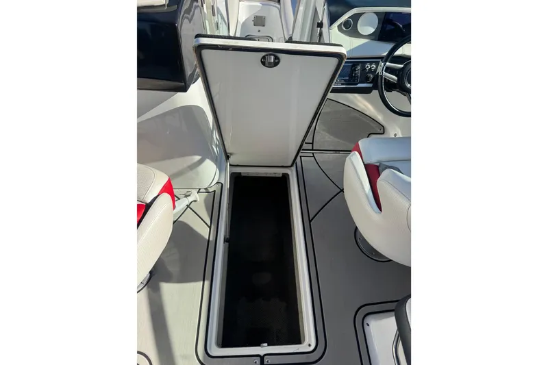Slide: The Image of 2020 Four Winns HD270 RS boat interior with open storage compartment. - 53