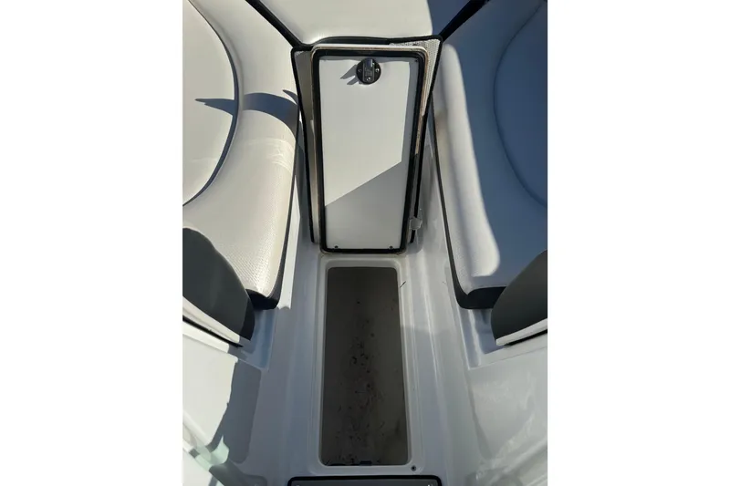 Slide: The Image of Interior view of 2020 Four Winns HD270 RS boat with seating and storage compartment. - 54