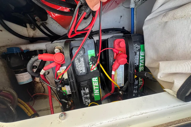 Slide: The Image of Batteries in a 2020 Four Winns HD270 RS boat, showing wiring and connections. - 58