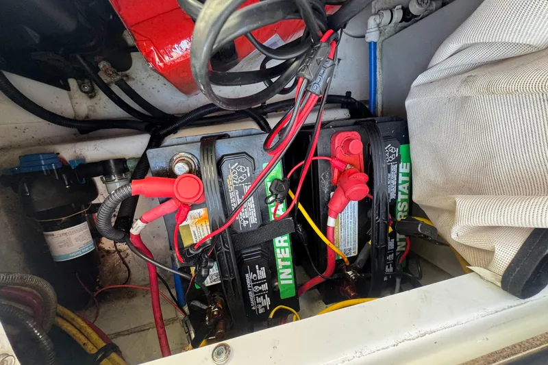 Slide: The Image of Battery compartment of 2020 Four Winns HD270 RS boat with Interstate batteries. - 59