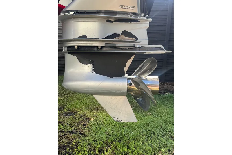 Slide: The Image of 2020 Four Winns HD270 RS boat propeller and lower unit, close-up view. - 60