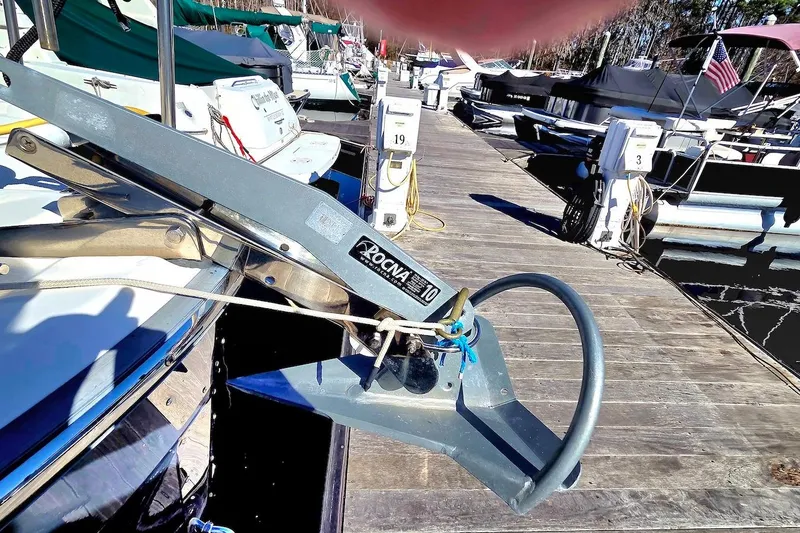 Slide: The Image of Interior of 2022 Ranger Tugs R-27 with wooden table and seating, dockside view. - 16