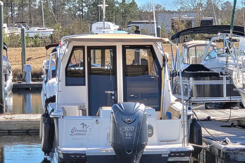 Slide: The Image of 2022 Ranger Tugs R-27 boat docked with Yamaha 300 V6 engine. - 5