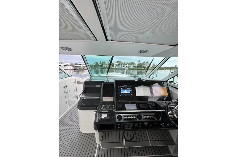 Slide: The Image of 2018 Formula 430 Super Sport Crossover helm with advanced navigation displays. - 11