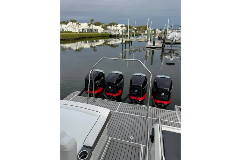 Slide: The Image of 2018 Formula 430 Super Sport Crossover with four powerful outboard engines docked at marina. - 24