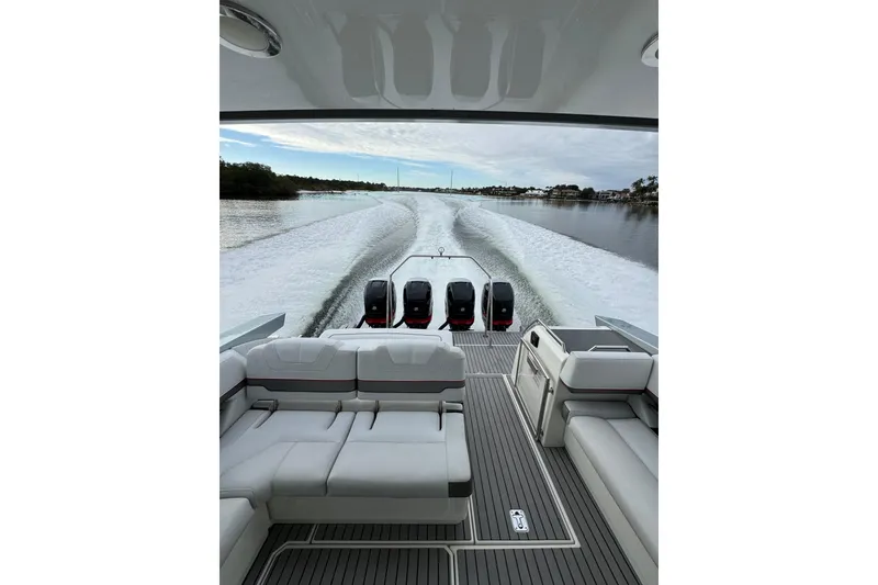 Slide: The Image of 2018 Formula 430 Super Sport Crossover cruising on a serene waterway. - 29