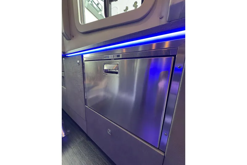 Slide: The Image of 2018 Formula 430 Super Sport Crossover interior with stainless steel appliance and blue LED lighting. - 33