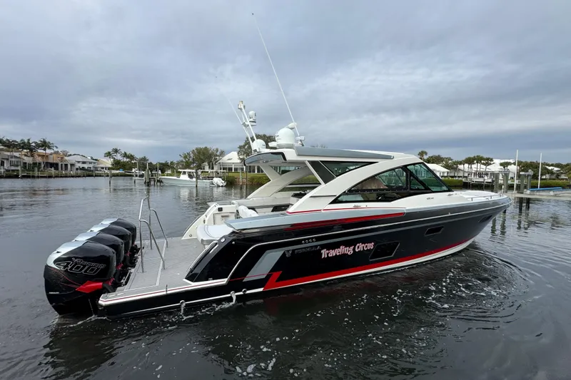 Slide: The Image of 2018 Formula 430 Super Sport Crossover boat on calm water, overcast sky. - 7