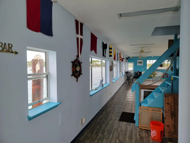 Slide: The Image of Floating home interior with nautical decor, flags, and waterfront views, Custom model, 2003. - 10