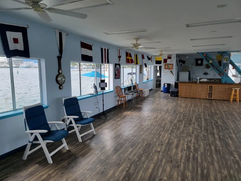 Slide: The Image of Floating home interior with nautical decor, wooden flooring, and waterfront views. - 14