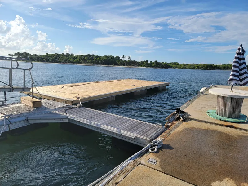 Slide: The Image of Floating platform on water with clear sky, Custom Floating Home, 2003 model. - 36