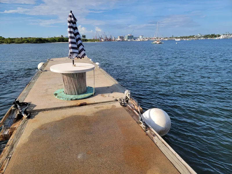 Slide: The Image of Floating home deck with table and umbrella on calm water, Custom model, 2003. - 44